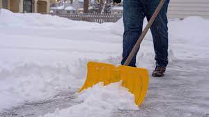 Person Shovelling Snow