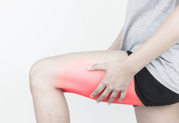 Woman holding her hamstring after sports injury