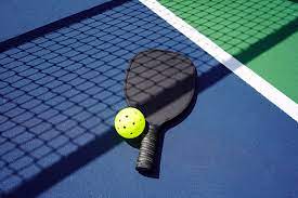 Pickleball racquet and ball