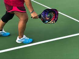 Person playing pickleball